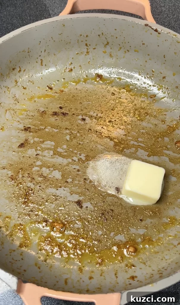 Onion and garlic cooking in a skillet
