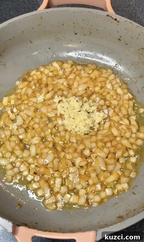 Garlic added to sautéed onion
