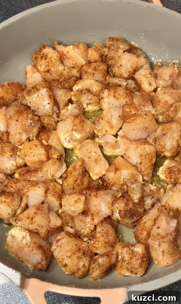 Chicken cooking in butter and olive oil