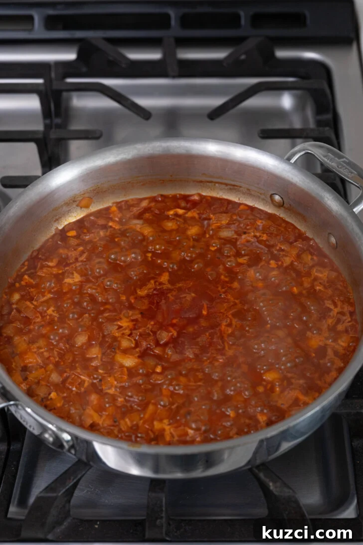 Patatas Bravas Recipe with Spicy Spanish Potatoes 6 Salsa brava in a pan.