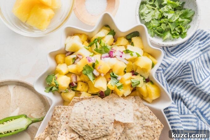 Fresh Pineapple Salsa with Jalapeño and Lime 6 Pineapple-shaped serving dish full of tortilla chips and a fresh pineapple salsa.
