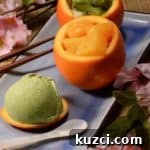 Green tea ice cream in orange bowls