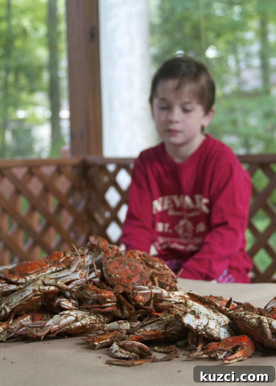 Child ready to eat steamed crabs
