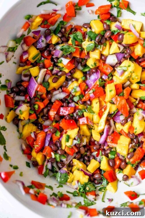 Mango black bean salad in a large mixing bowl.