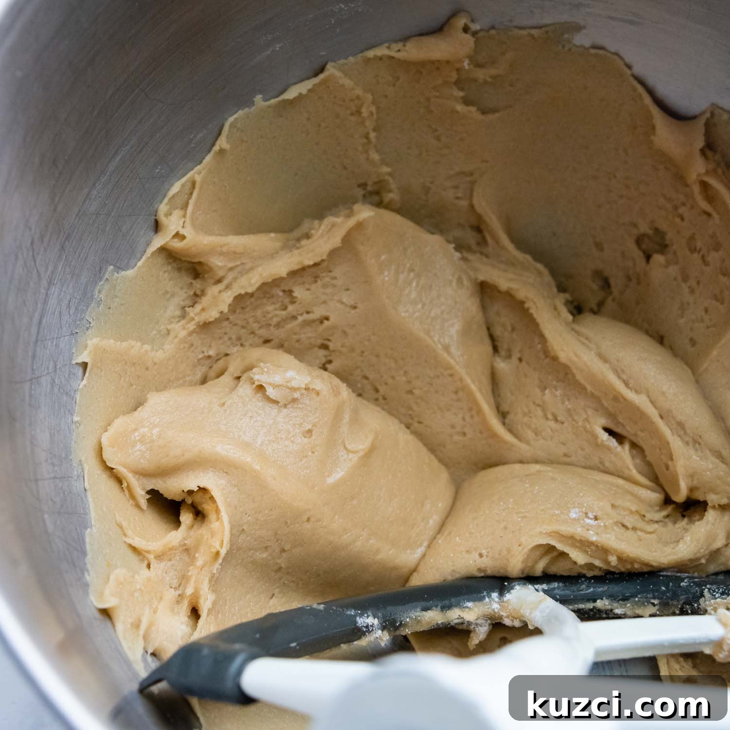 Gluten-free chocolate chip cookie dough mixed in a bowl.