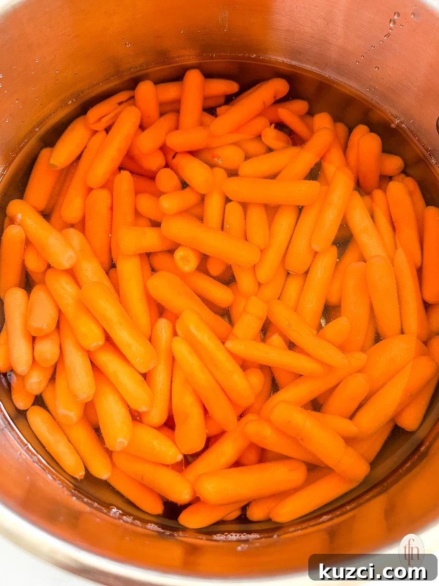 Carrots in a pot with water.