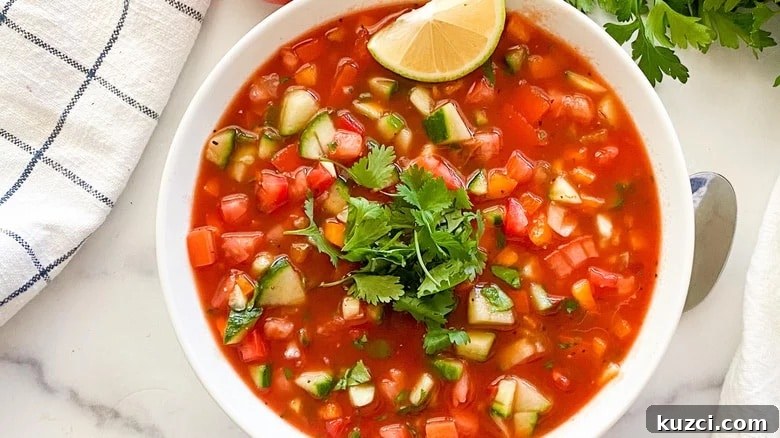 9 Cold Soup Recipes to Keep Your Kitchen Cool 12 The top view of a bowl of gazpacho.