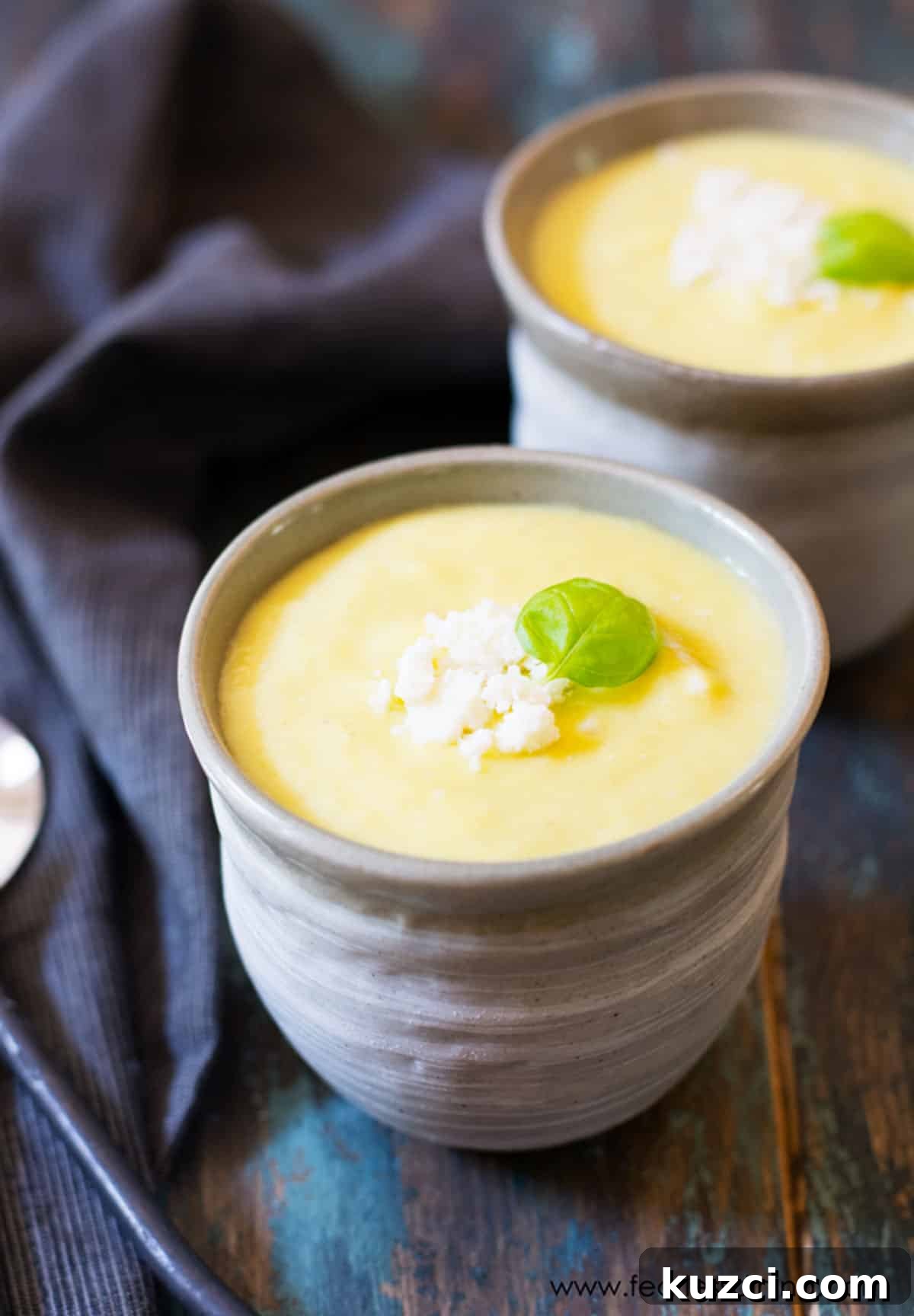 9 Cold Soup Recipes to Keep Your Kitchen Cool 6 Two small bowls of chilled pineapple soup.