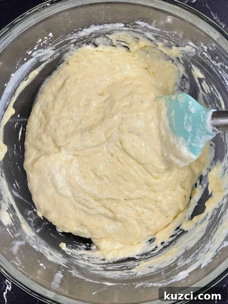Fluffy Homemade Buttermilk Banana Pancakes 9 Folding whipped egg whites into batter for a light and airy texture.