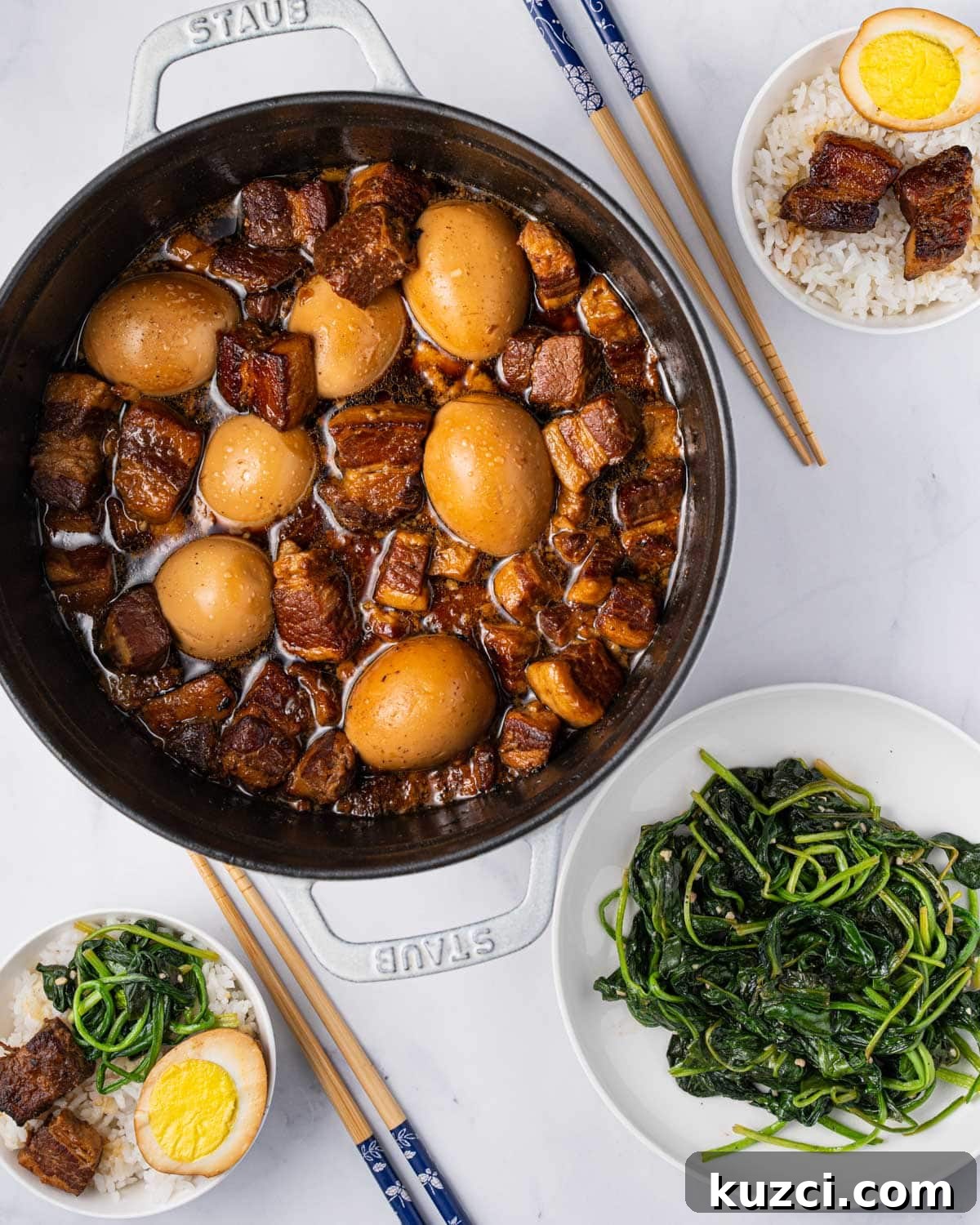 pot of thit kho with two bowls of rice and a side plate of green vegetables.