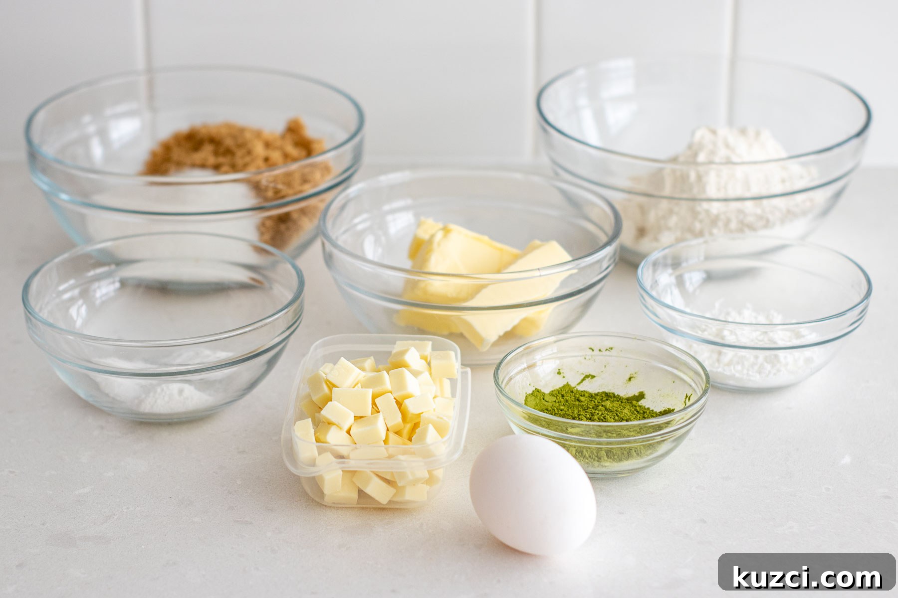 Homemade Matcha White Chocolate Chip Cookies Recipe 3 Ingredients of the matcha cookies recipe, separated in clear bowls.