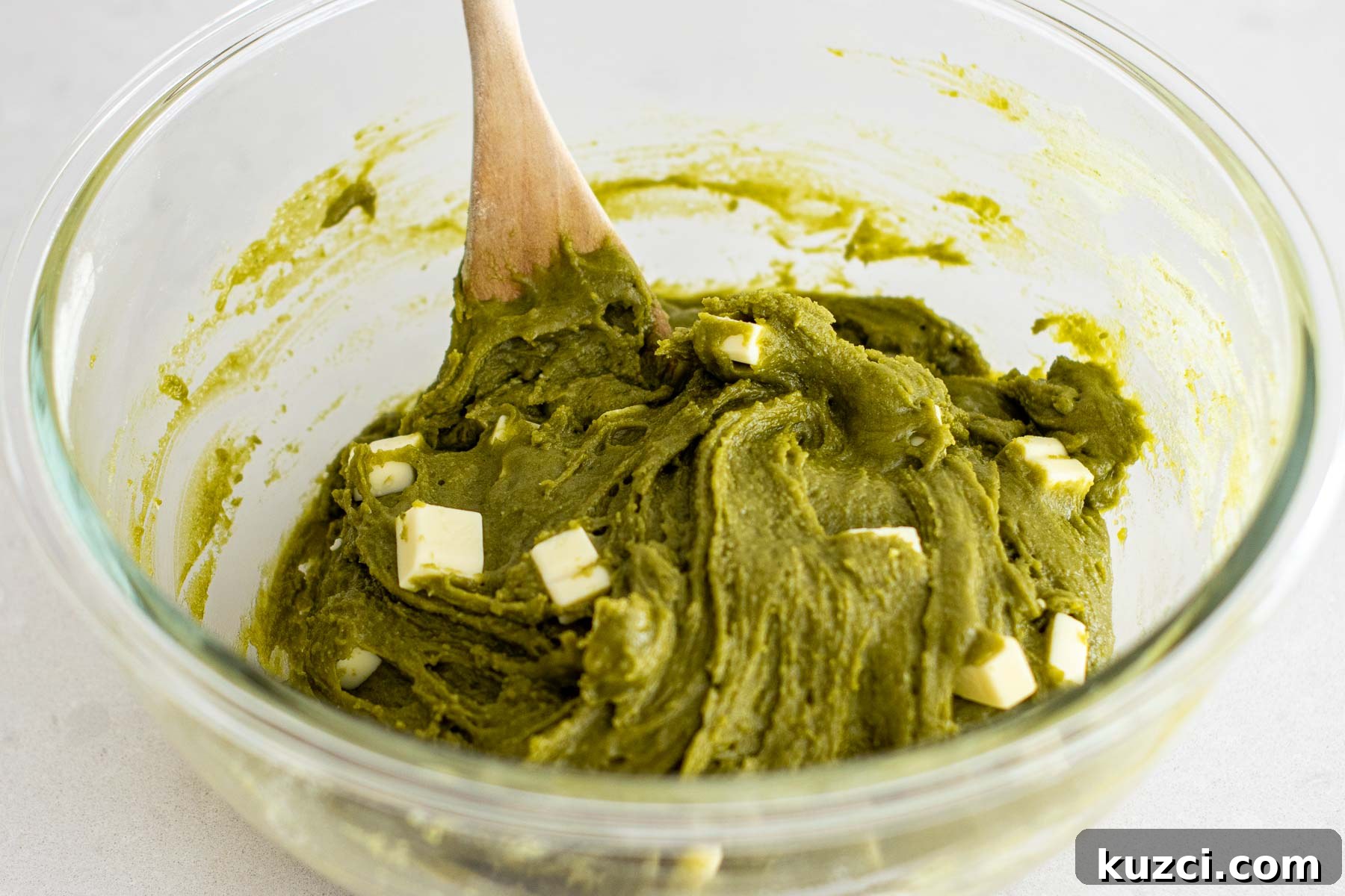 Homemade Matcha White Chocolate Chip Cookies Recipe 8 Adding white chocolate chunks to dough.