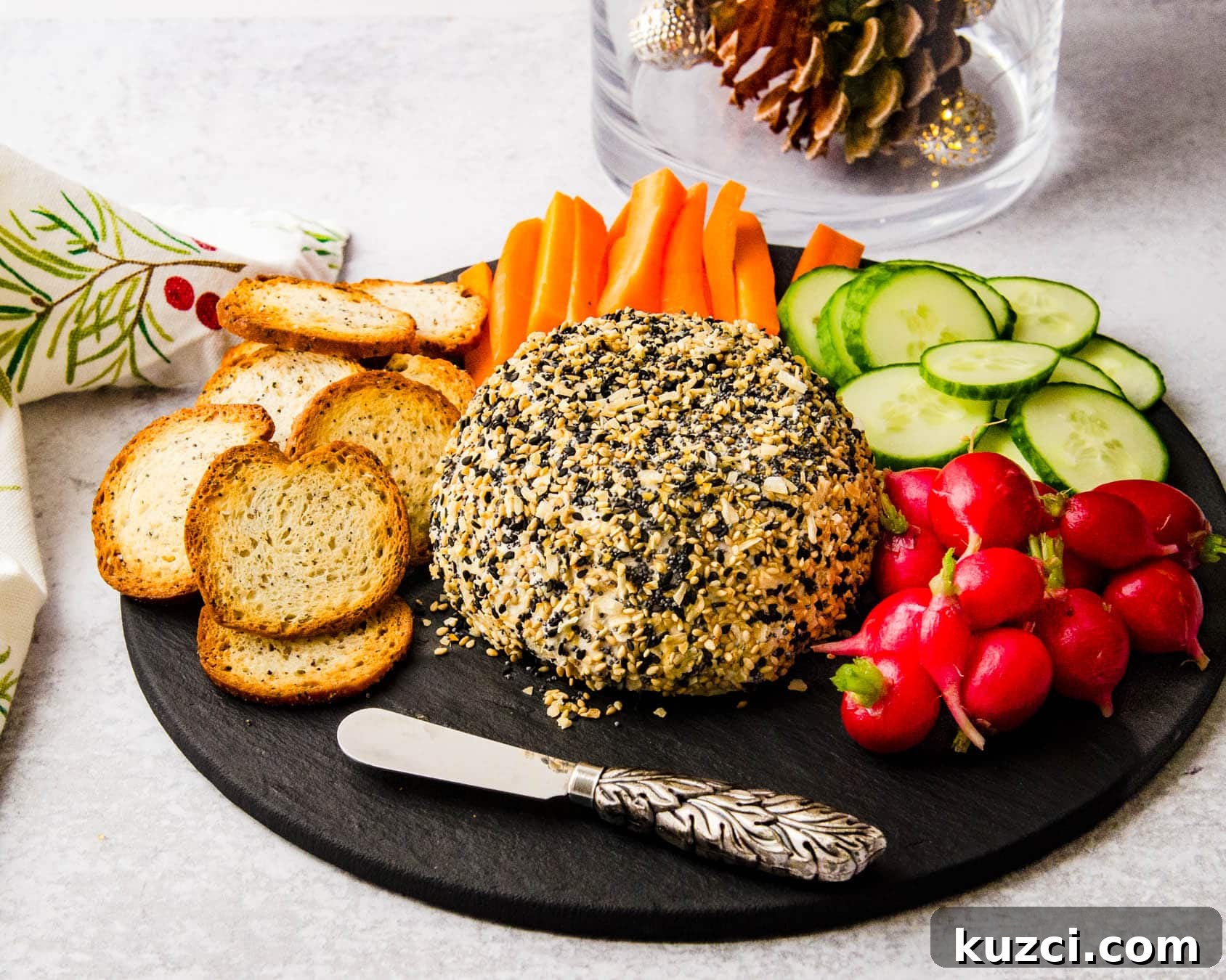 Smoked Salmon Cheese Ball with Dill and Capers 13 A salmon and goat cheese appetizer on a charcuterie board.