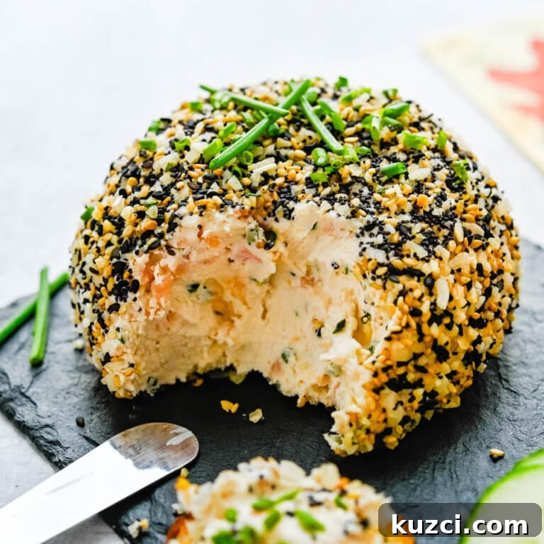 Smoked Salmon Cheese Ball with Dill and Capers 18 Smoked salmon cheese ball on a platter.
