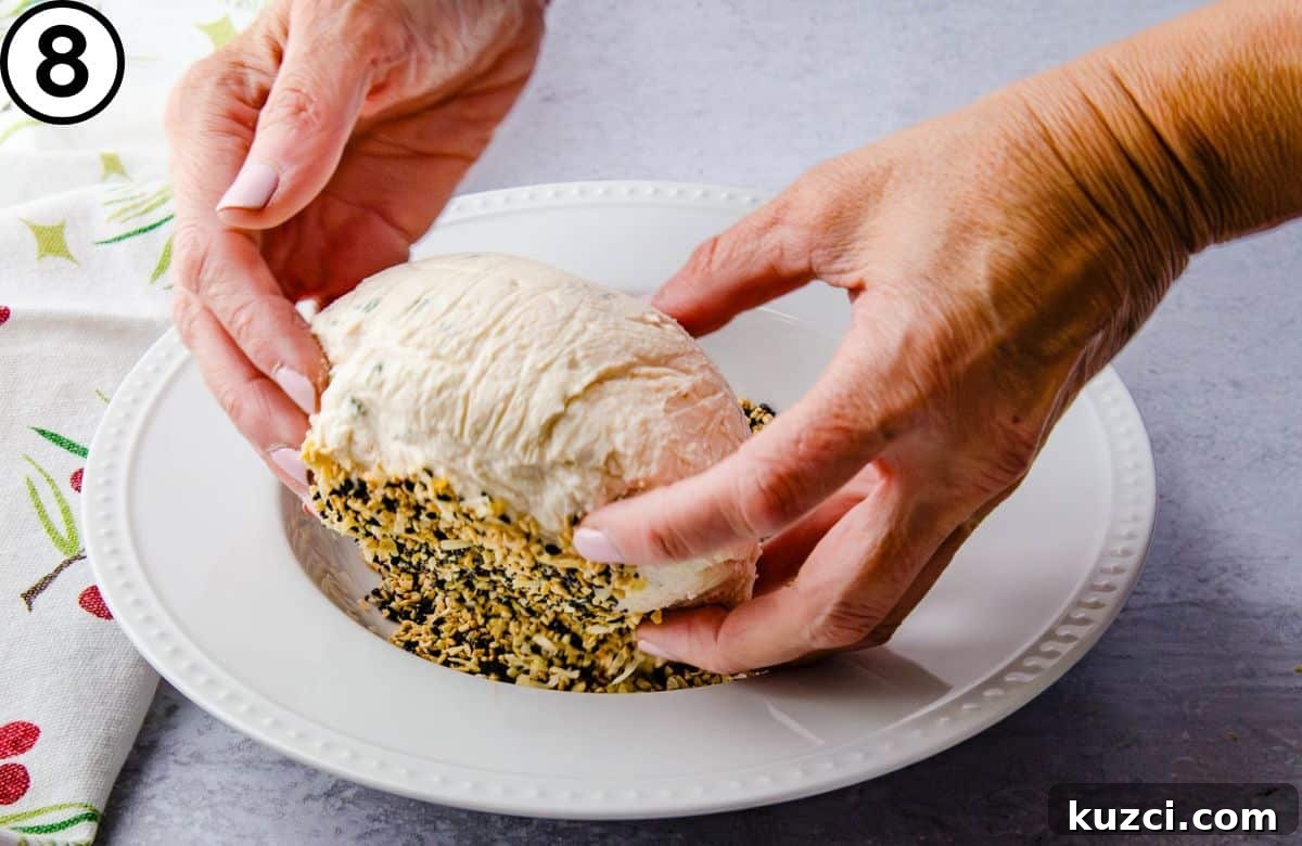 Smoked Salmon Cheese Ball with Dill and Capers 10 Flipping the goat cheese ball.