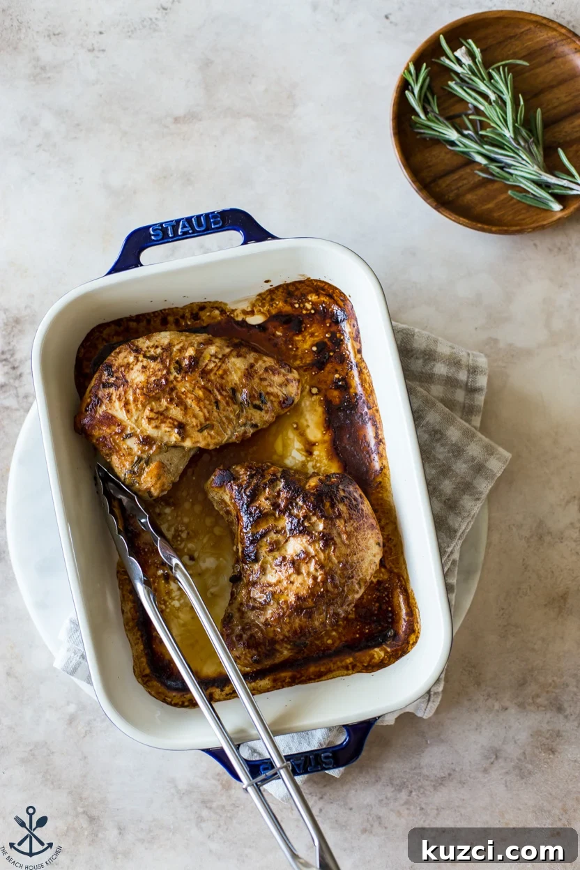 Overhead photo of cooked turkey tenderloins in a blue baking dish