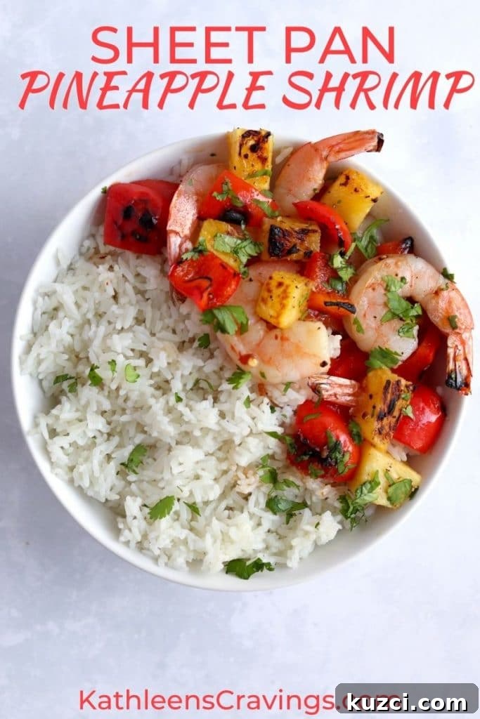 Sheet Pan Shrimp with Pineapple and Garlic Lime Glaze 2 Pineapple shrimp with rice in a bowl.