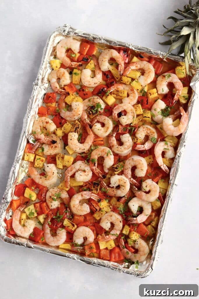 Sheet Pan Shrimp with Pineapple and Garlic Lime Glaze 4 Pineapple, shrimp, and bell peppers roasted on a sheet pan.