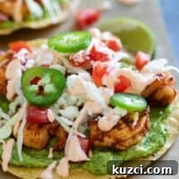 Easy spicy shrimp tostadas with guacamole and spicy sauce.