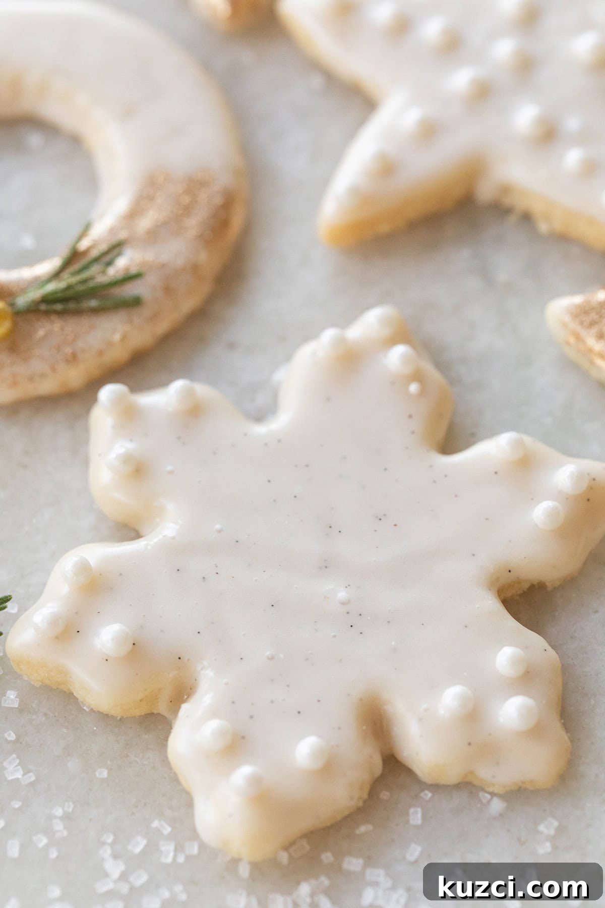 Cookie Recipes for Holidays, Parties, and Everyday Treats 20 Snowflake shortbread cookie with vanilla glaze.