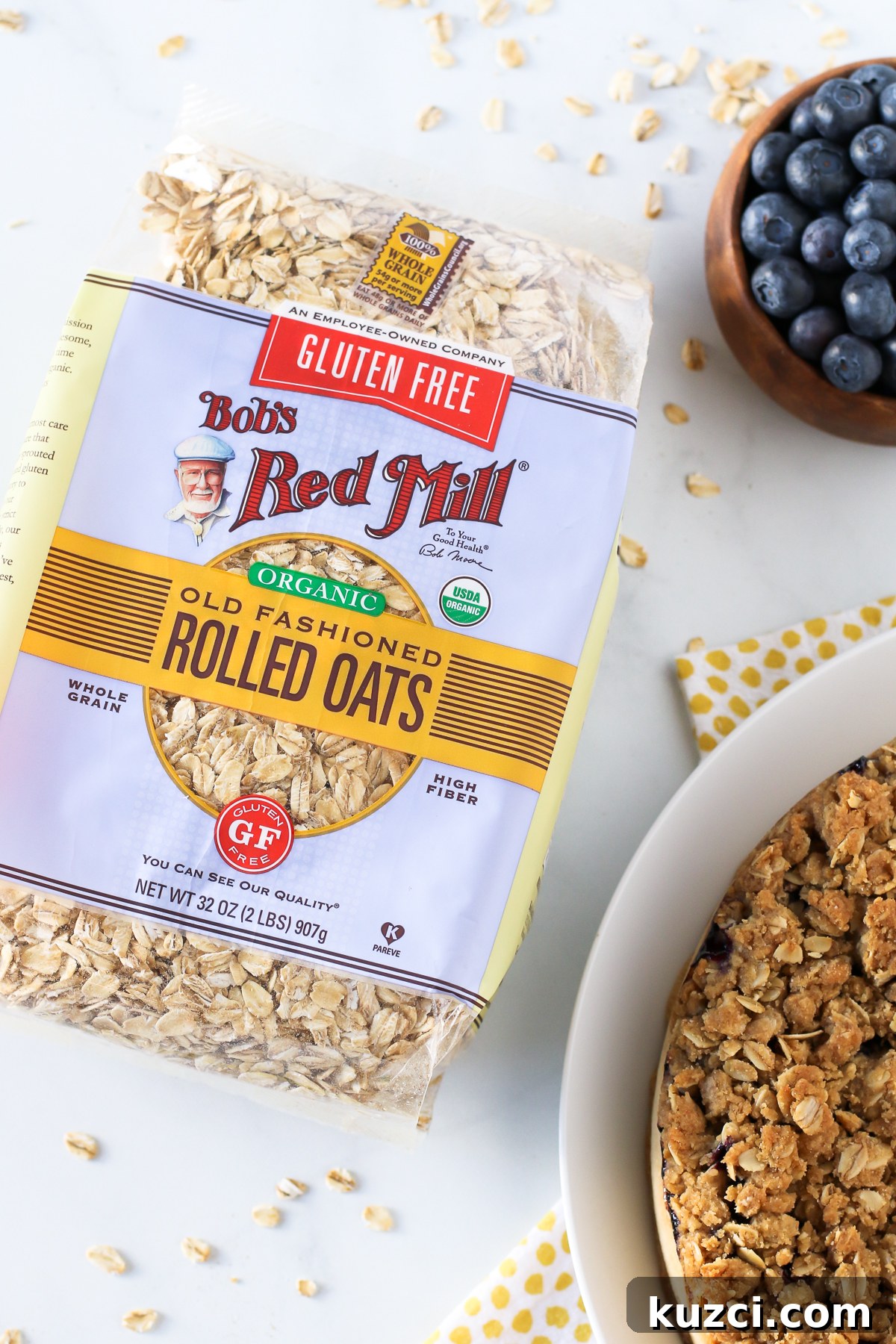 Gluten Free Vegan Blueberry Coffee Cake. Light vanilla cake with a layer of fresh, juicy blueberries and an oat crumb topping. Recipe featuring Bob’s Red Mill Organic Gluten Free Rolled Oats!