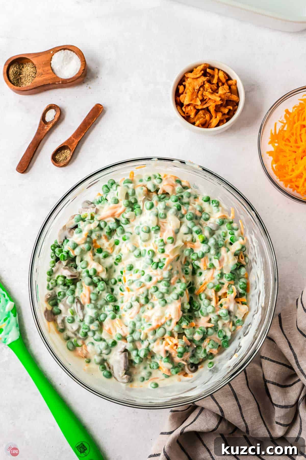 peas, cheese, and cheese sauce in a bowl