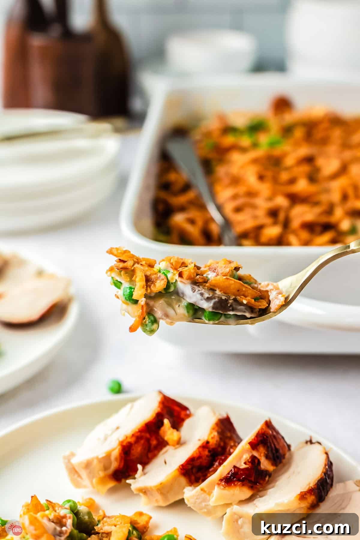close up of fork with a bite of peas and mushrooms