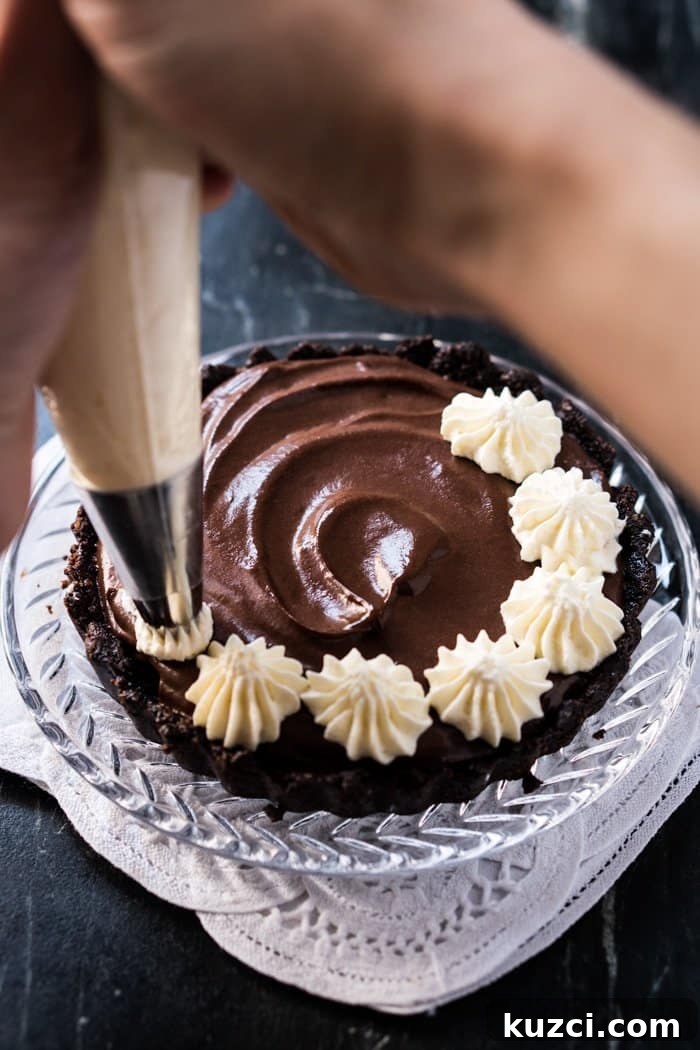 No Bake Chocolate French Silk Pie for One Gluten Free Keto Paleo 4 Piping whipped cream onto a keto French silk pie