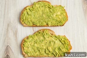 Tomato Goat Cheese Avocado Toast 12 Toast topped with mashed avocado.