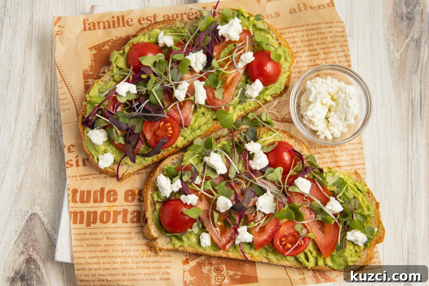 Tomato Goat Cheese Avocado Toast 8 Two avocado toasts with tomato, goat cheese and microgreens.
