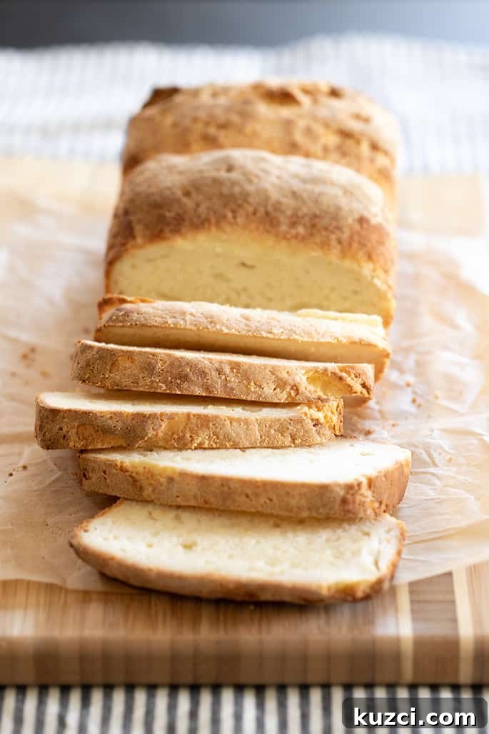 A loaf of sandwich bread half sliced