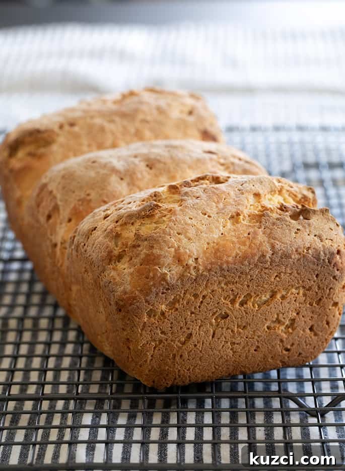 A loaf of Japanese milk bread on a wire rack
