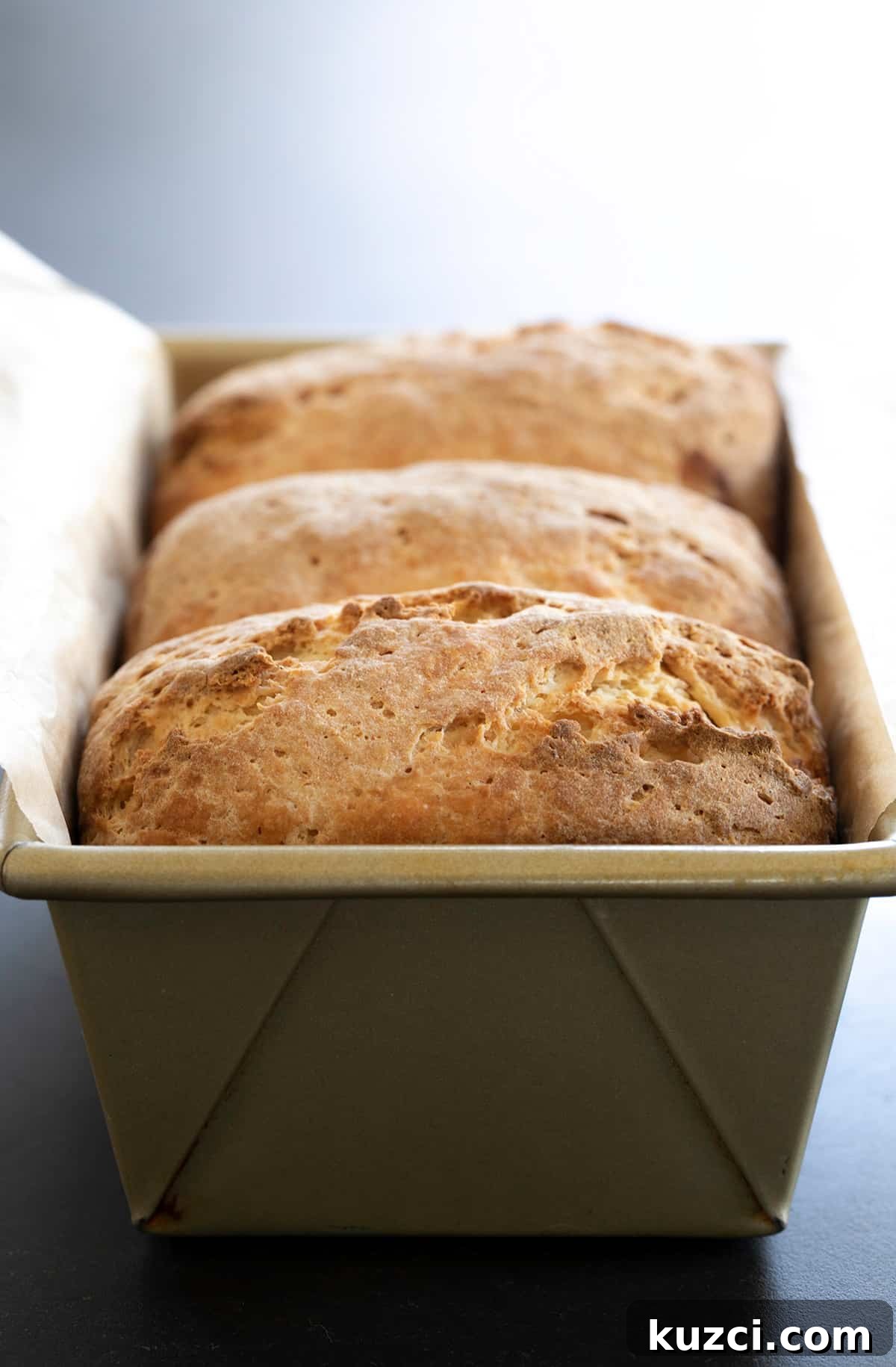 Closeup image of Japanese milk bread in a loaf pan
