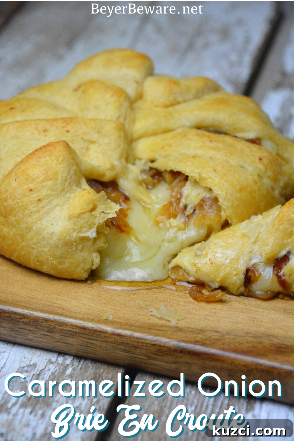 Caramelized Onion Baked Brie Crescent Ring (Brie en Croute) 2 Caramelized onion baked brie crescent round is a simple brie en croute recipe made with caramelized onions and brie for a baked brie recipe.
