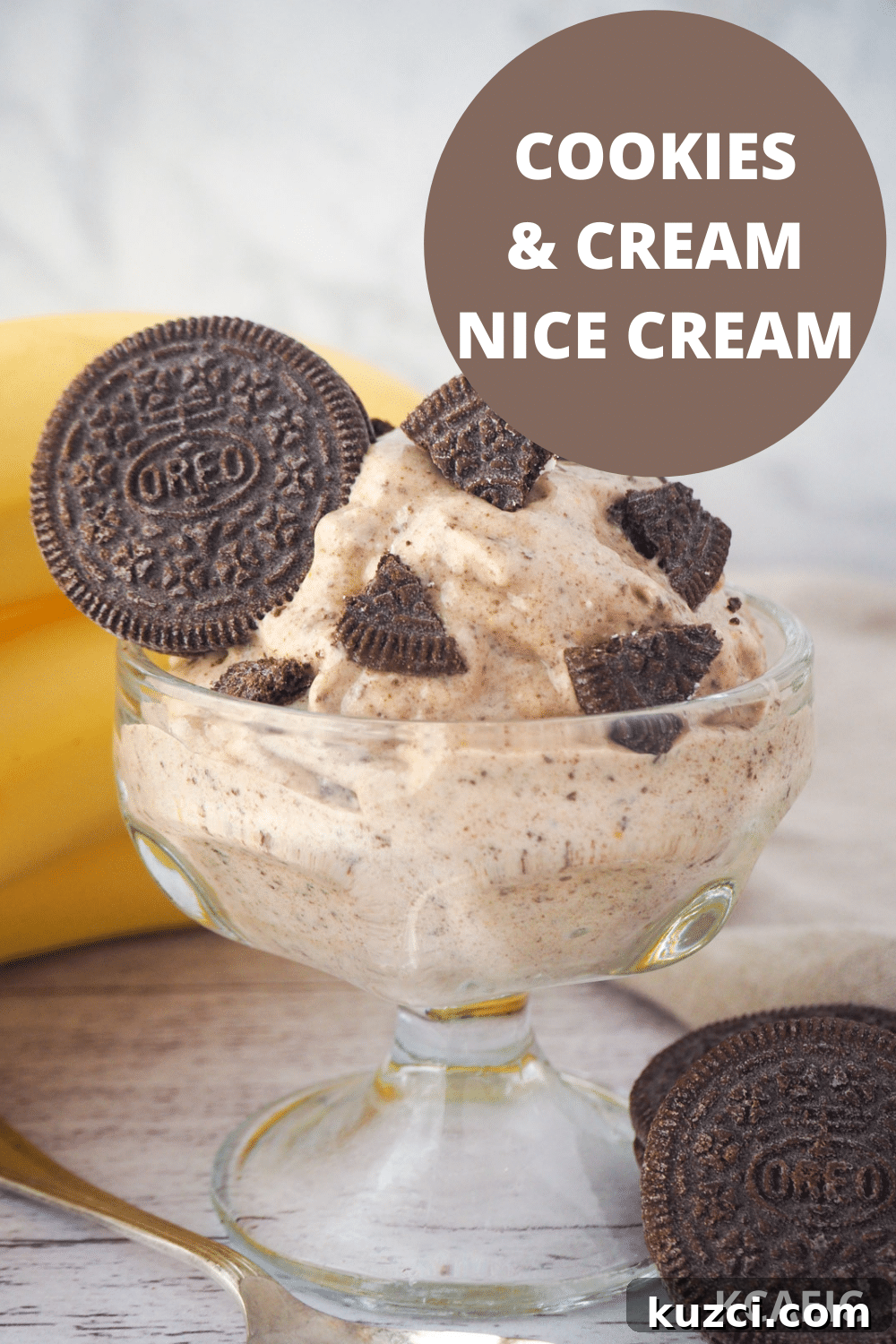 Cookies and Cream Nice Cream Recipe 15 Serve of cookies and cream nice cream in a bowl, with pieces of Oreos, bananas and whole Oreos in the background and text overlay, cookies and cream nice cream and KCAEIC.