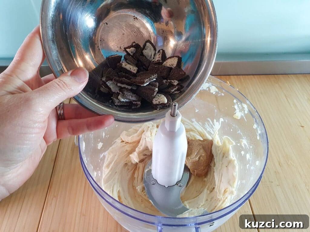 Cookies and Cream Nice Cream Recipe 10 Adding chopped Oreos to blended bananas.