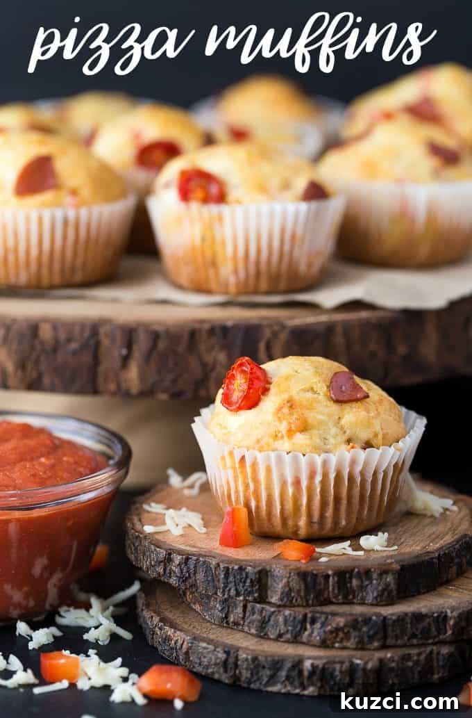 Mini Pizza Muffins with Mozzarella and Pepperoni 5 Pizza Muffins - This kid friendly snack tastes and smells like pizza, but in a muffin form. Add in your fave toppings to change it up!