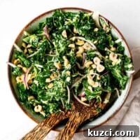 Chopped kale salad with tahini dressing, red onions and toasted hazelnuts.