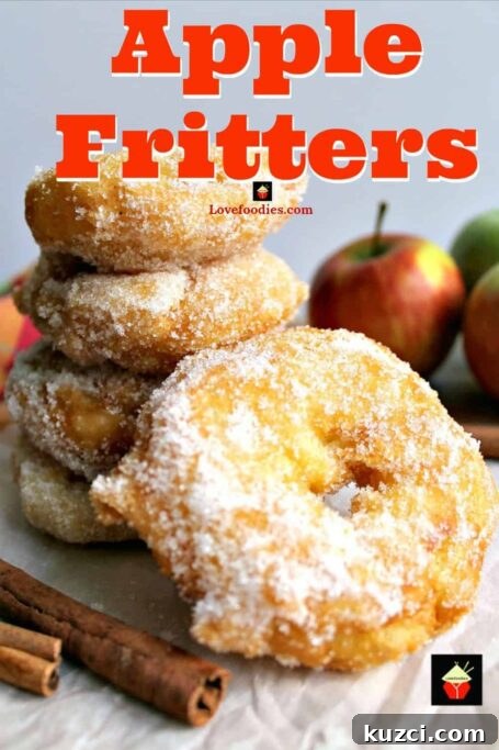 Apple fritters: apple rings in a crispy light batter coated in cinnamon sugar, served warm