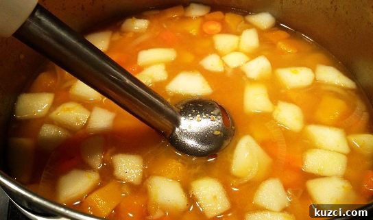 Soothing Turmeric and Ginger Anti-Inflammatory Soup Recipe 3 Pureeing butternut squash soup with immersion blender.