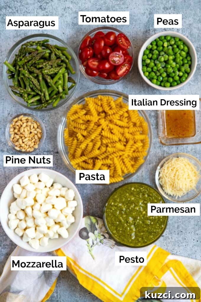 Ingredients for making this pasta salad recipe in small glass bowls.