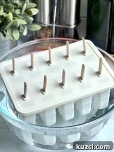 Removing frozen paletas from the mold