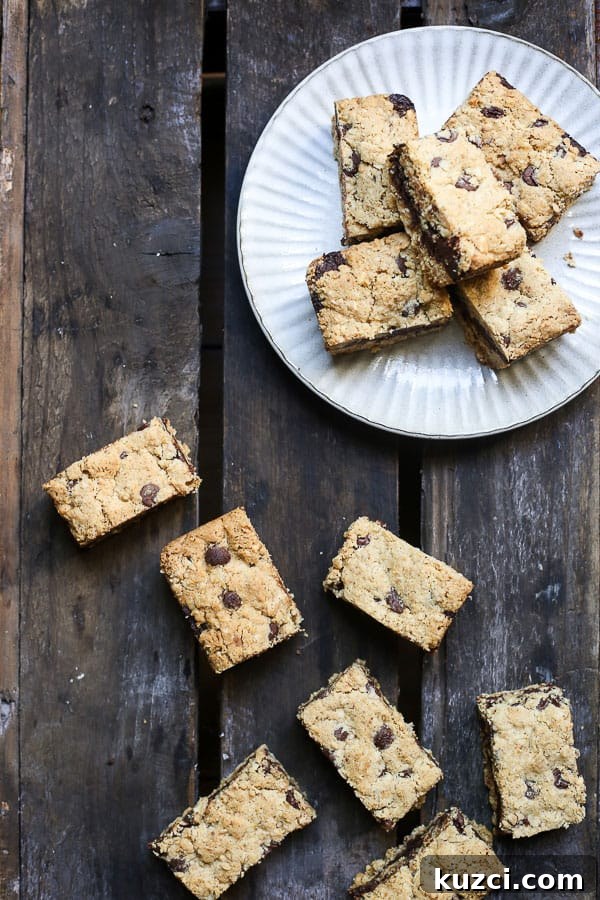 overhead of Nutella Fudge Oat Bars on a plate and on wooden table