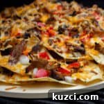 Nachos baked on a round pizza stone
