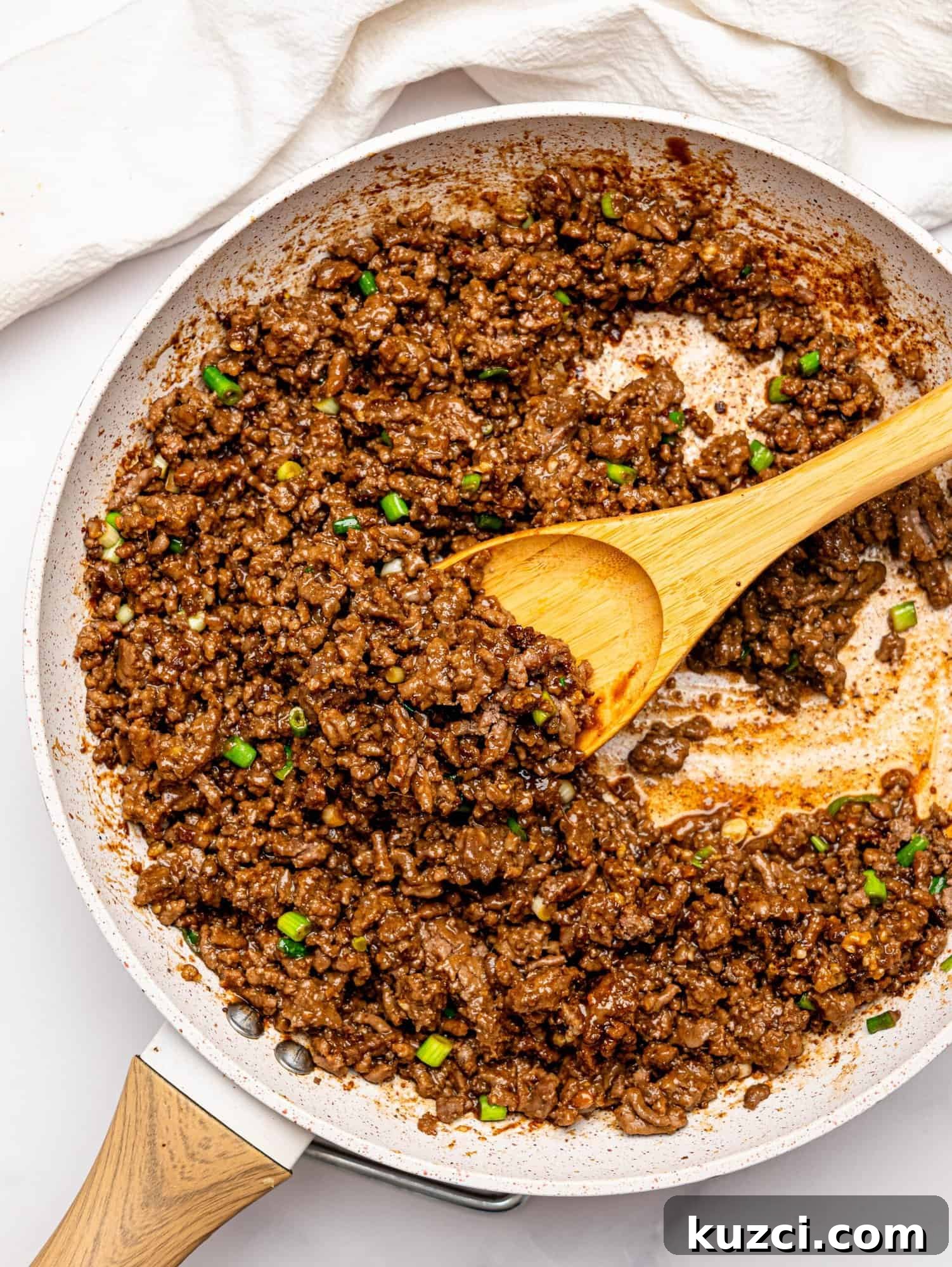 High Protein Teriyaki Beef Bowls for Meal Prep 11 Teriyaki beef in a frying pan.