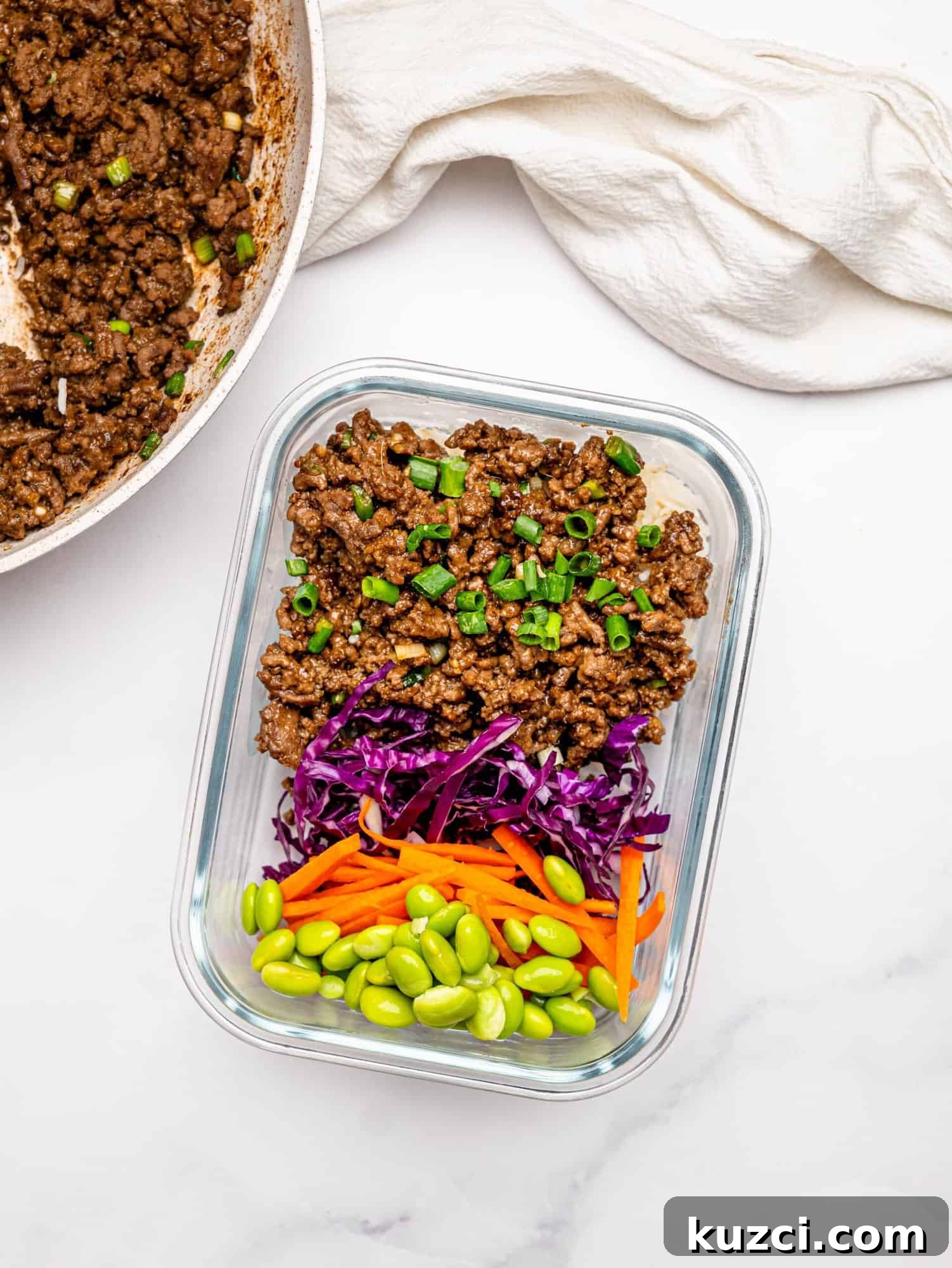 High Protein Teriyaki Beef Bowls for Meal Prep 3 Teriyaki beef in a glass tupperware.