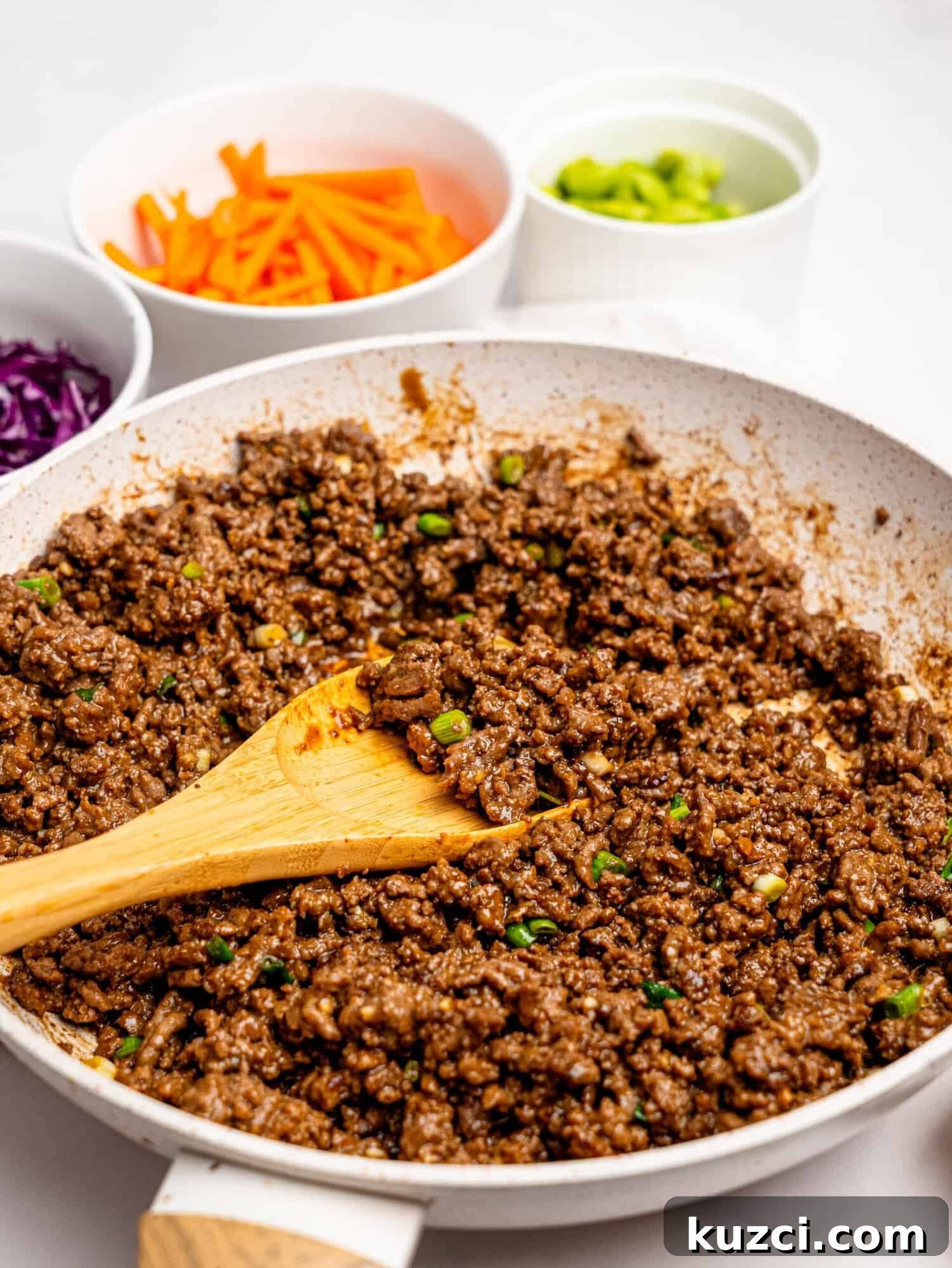 High Protein Teriyaki Beef Bowls for Meal Prep 4 Teriyaki beef in a frying pan.