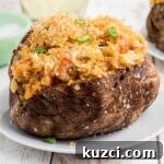 Crawfish-Stuffed Baked Potatoes Recipe 13 Close up of a crawfish baked potato cropped square.