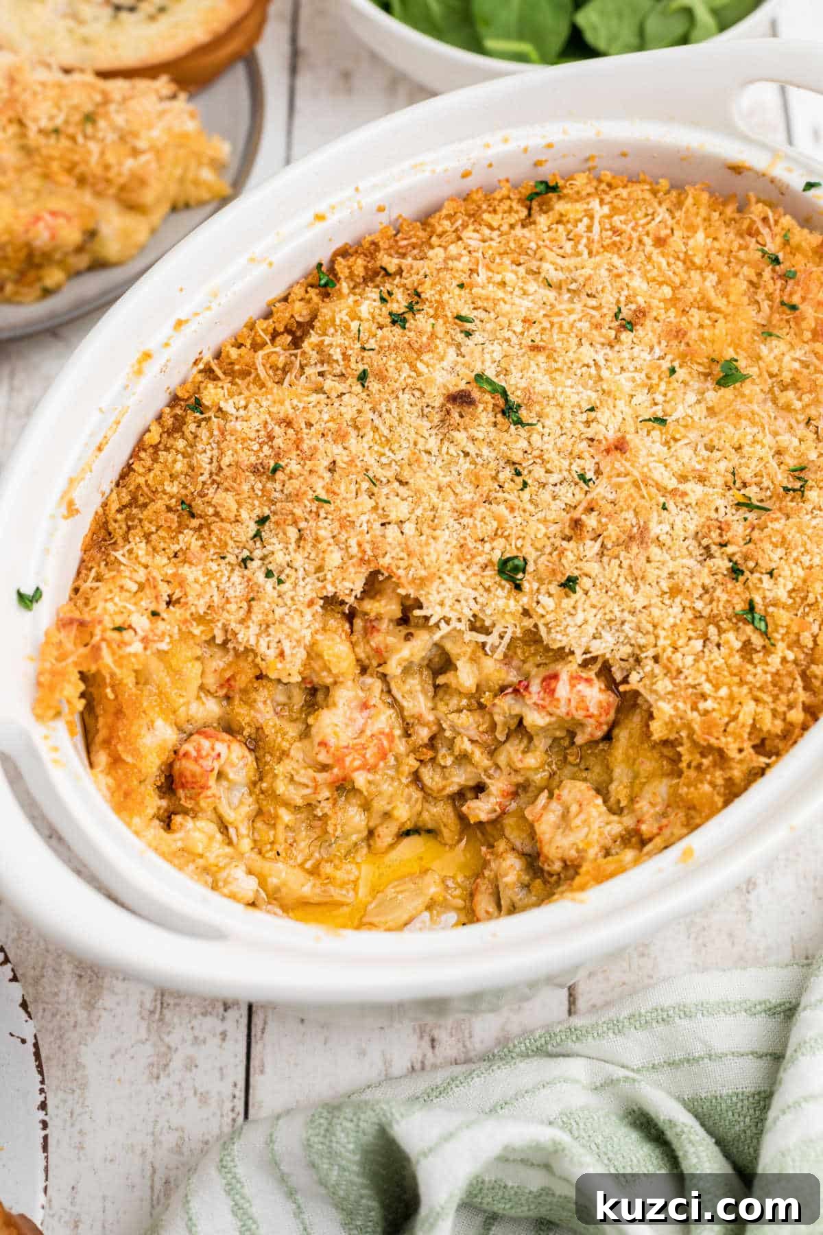 Crawfish-Stuffed Baked Potatoes Recipe 5 Portrait shot of a dish full of crawfish au gratin.