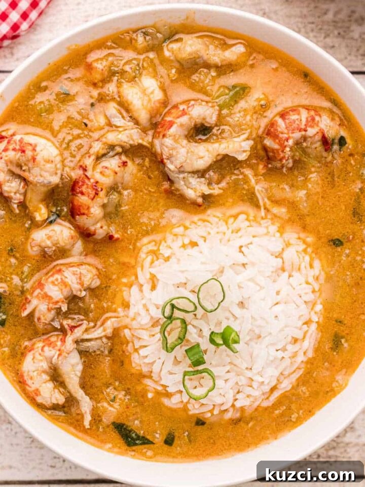 Crawfish-Stuffed Baked Potatoes Recipe 7 Bowl of crawfish etouffee with rice scoop in the middle.